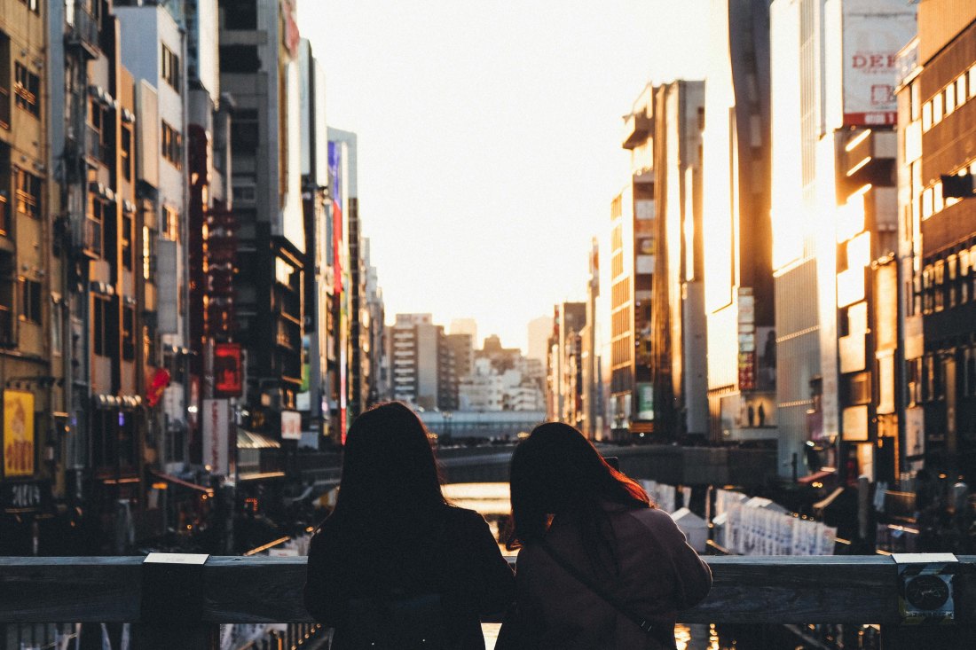 Street photowalk. Sunset in Dotonbori.